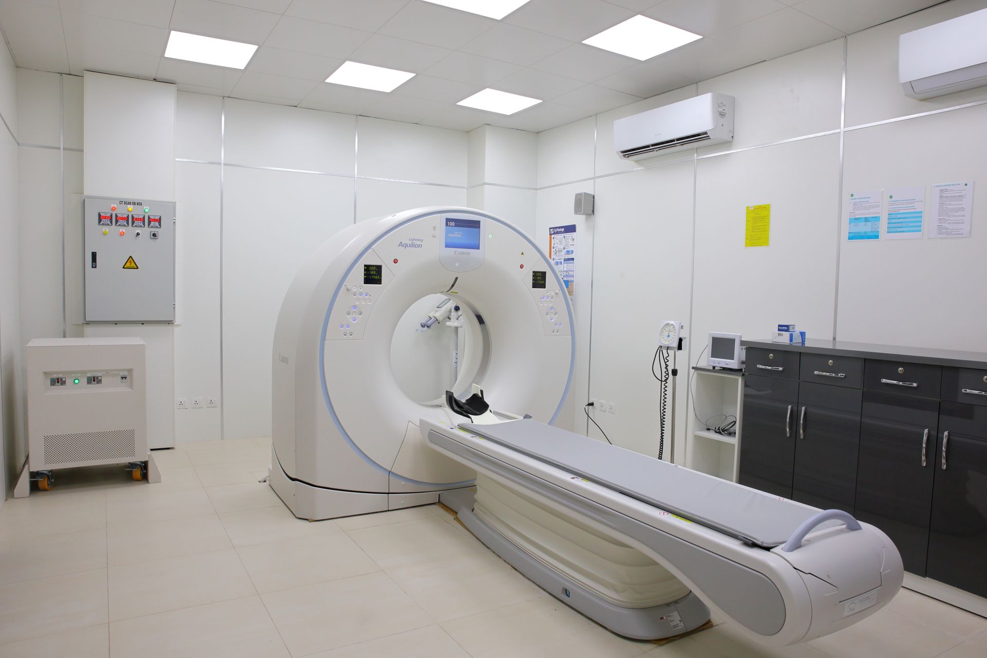 Bright sterile medical imaging room with advanced CT scanner